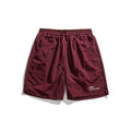 Lockere Sportshorts mit schlichter Buchstabenstickerei