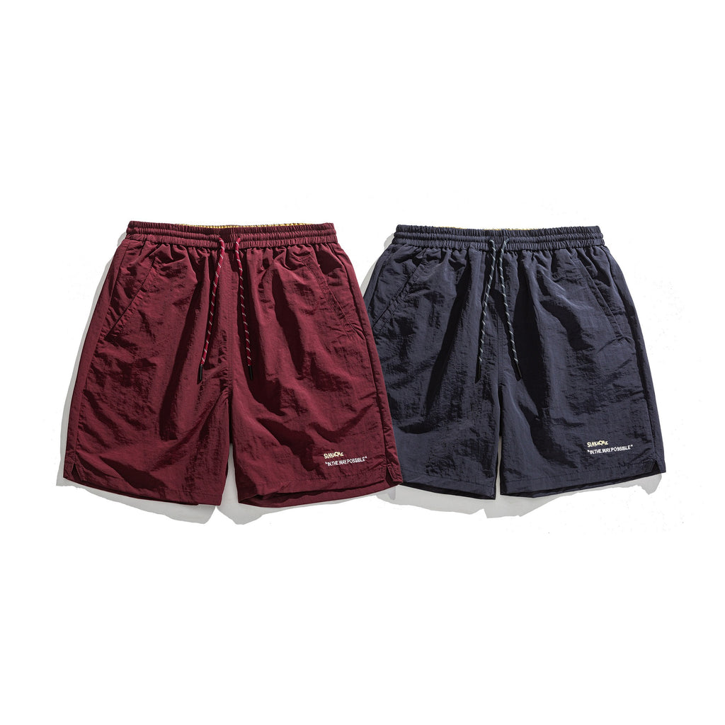 Lockere Sportshorts mit schlichter Buchstabenstickerei
